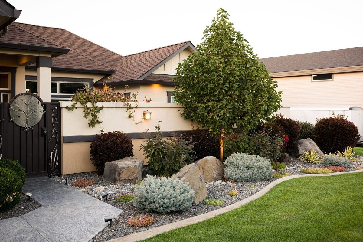 Backyard paver patio with clean banding and a firepit seating area